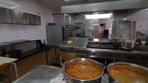 Bubbling meat soup, inside a metal pot, at a restaurant kitchen Stock Footage 90231580