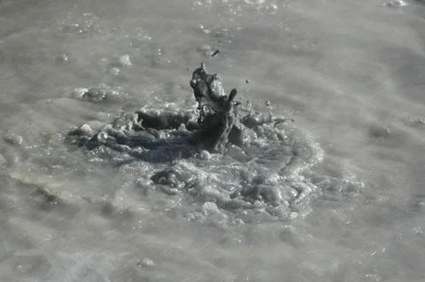 Bubbling mud in a boiling mud pool. Stock Photos