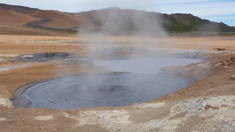 A bubbling mud pool in a geothermal area along a road near Myvatn, Iceland. Vídeo Stock 94261875