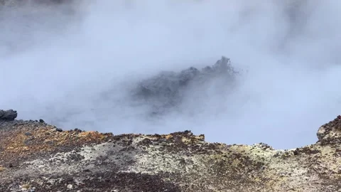 Bubbling mud pot splashing hot water and steam at Seltun Geothermal Area in Stock Footage 341466213