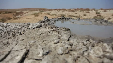Bubbling mud volcano. Movement from left to right. Stock Footage 41087824