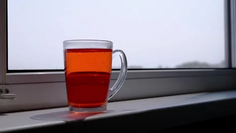 Bubbling Red Drink on Bright Windowsill 스톡 동영상 317561494