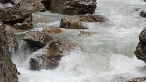 Bubbling stream of a mountain river. Rocky rapids Stock Footage 168184822