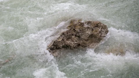 Bubbling stream of water in a mountain river, close up Stock Footage 168178345