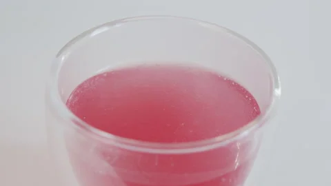 Bubbling surface of effervescent tablet drink 4K slow-mo video Stock Footage 156209615