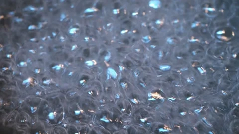 Bubbling water abstract background close up Stock Footage 318297858