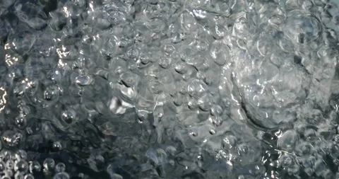 Bubbling water with air bubbles. Cavitation of water flow. Water texture. Stock Footage 337468020
