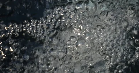 Bubbling water with air bubbles. Cavitation of water flow. Water texture. Stock Footage 337468737