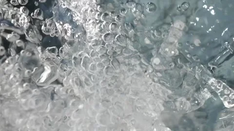 Bubbling water with air bubbles. Cavitation of water flow. Water texture. Stock Footage 337725329