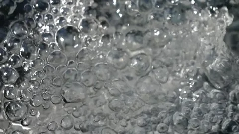 Bubbling water with air bubbles. Cavitation of water flow. Water texture. Stock Footage 337725460