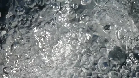 Bubbling water with air bubbles. Cavitation of water flow. Water texture. Stock Footage 337725550