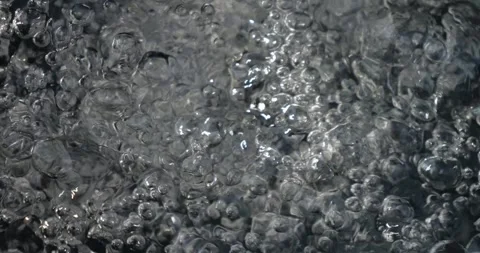 Bubbling water with air bubbles. Cavitation of water flow. Water texture. Stock Footage 337726108