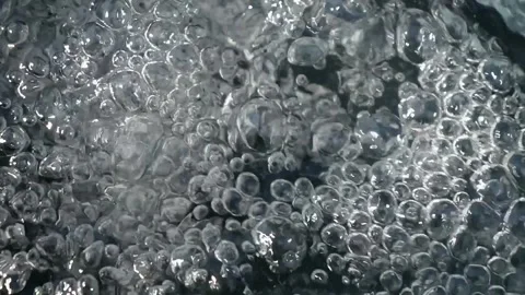Bubbling water with air bubbles. Cavitation of water flow. Water texture. Stock Footage 337767696