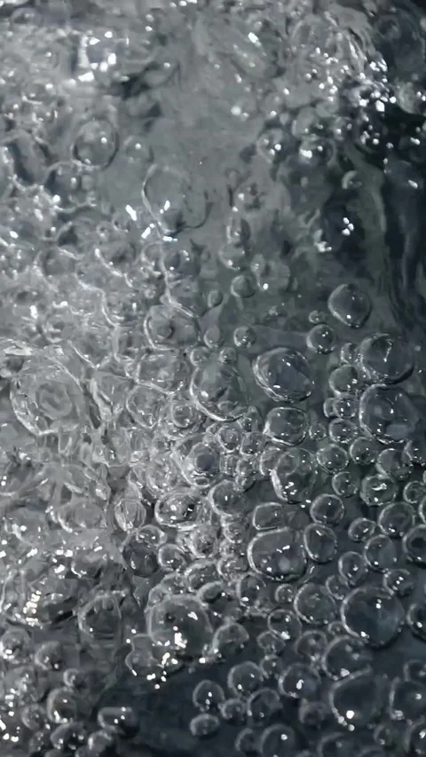 Bubbling water with air bubbles. Cavitation of water flow. Water texture. Stock Footage 337767881