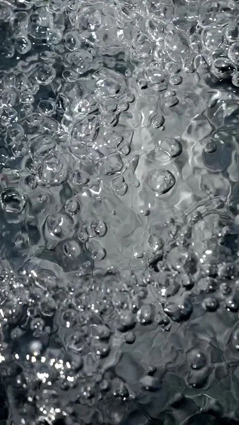 Bubbling water with air bubbles. Cavitation of water flow. Water texture. Stock Footage 337768028