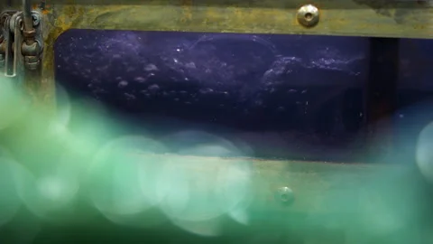 Bubbling water on container with glass window in factory workshop Stock Footage 304385092