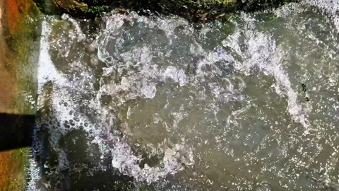 Bubbling Water Flow from Small Concrete Sluice 스톡 동영상 331920054