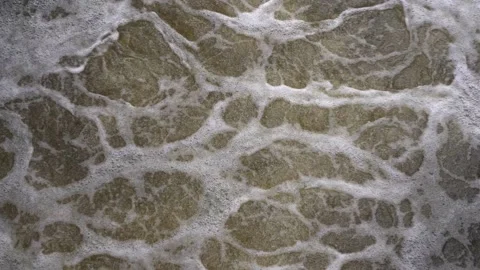 Bubbling water with foam in a river or lake. Liquid water surface in nature Stock Footage 197252963
