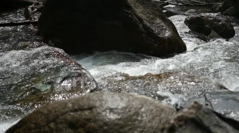 The bubbling water in a mountain river Video stock 66354056