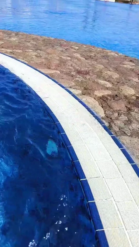 Bubbling water in the pool: hydromassage or fountain in the resort area Stock Footage 311079597