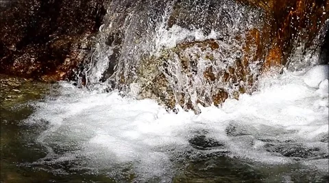Bubbling water at a waterfall Video stock 63384158
