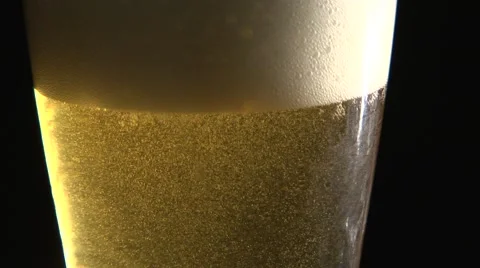 Bubbly Beer Settling Close Up Stock Footage 47489625