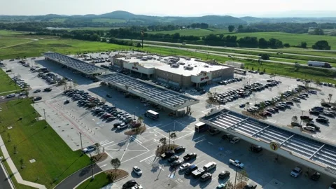 Buc-ee’s mega travel center with gas pumps, parking lot, store, cars and Stock Footage 316218905