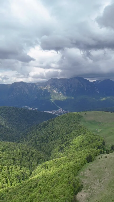 Bucegi Mountains aerial view from Baiu forested slopes Romania spring Stock Footage 335072063