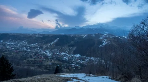 Bucegi Mountains between clouds anf fog in a cold winter morning Stock Footage 46332500