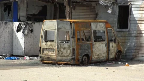 Bucha. April 12 2022 War in Ukraine.Car and warehouse bombed by Russian missiles Video stock 179481880