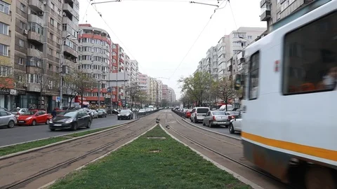 Bucharest City with Tramway on Tracks and Cars Traffic Jam on Crowded Street Day Stock Footage 106836530