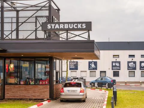 Bucharest Romania - 12.21.2020: Starbucks coffeehouse chain Drive Thru at Mil Stock Photos