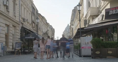 BUCHAREST, ROMANIA - AUGUST 4TH 2017: Time lapse of people walking by shops Stock Footage 78991827