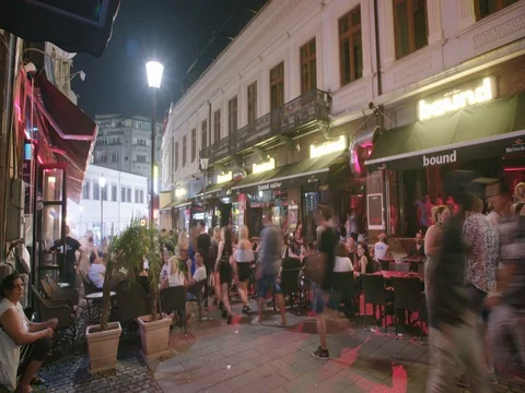 BUCHAREST, ROMANIA - AUGUST 4TH 2017: Time lapse of tourists at night Stock Footage 78992569