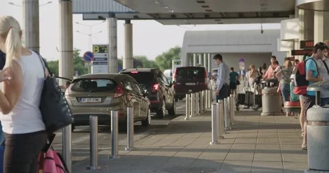 BUCHAREST, ROMANIA - AUGUST 6TH 2017: Taxis and buses arrive at the airport Video stock 78992691