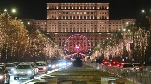 BUCHAREST, ROMANIA - December 21, 2025 Christmas Market and Ferris Wheel Stock Footage 345601006