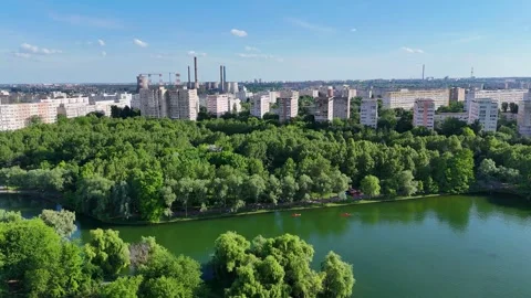 BUCHAREST, ROMANIA - JUNE 15, 2026: Urban Lake and Industrial Power Plant Video stock 339096500