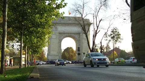 BUCHAREST, ROMANIA - MAY 18, 2018: A street view of the Arch of Triumph. Stock Footage 320949457