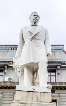 BUCHAREST, ROMANIA - MAY 25, 2014: The marble statue of Spiru Haret build by  Stock Photos