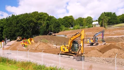 Bucket Of Backhoe Digger And Tipper Truck Excavating Earth In Dundee Stock Footage 282521340