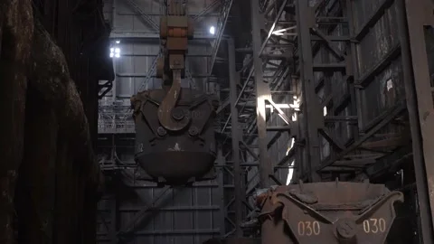 A bucket with cast iron moves on the workshop of a metallurgical plant Stock Footage 152576506