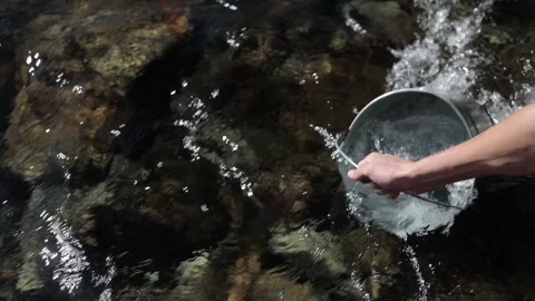 A bucket of clean water from a mountain river Stock Footage 280433265