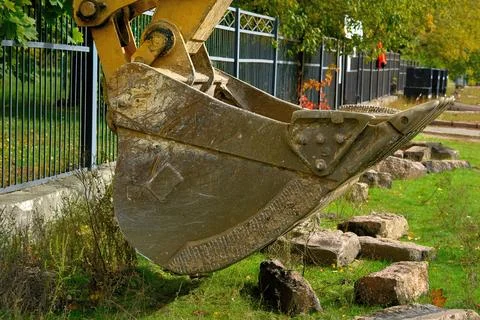 Bucket of excavator bulldozer for loading bulk cargo,construction site Stock Photos