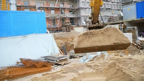 The bucket of the excavator digs the ground Stock Footage 121728586