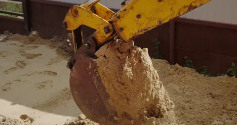 The bucket of the excavator digs the ground Stock Footage 140233841