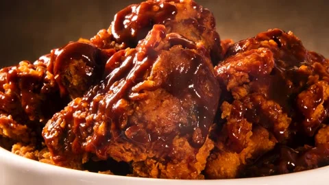 Bucket full of crispy kentucky fried chicken with smoke and barbecue sauce on Stock Footage 142592953