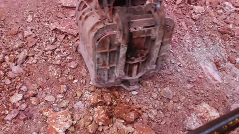 The bucket of a huge mining excavator is gaining bauxite. Stock Footage