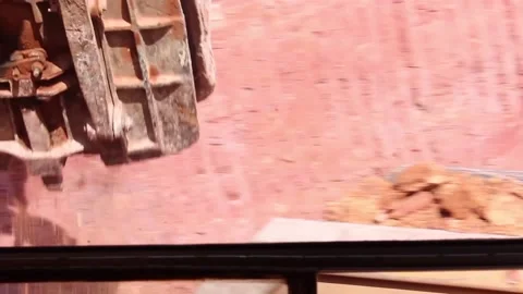 The bucket of a huge mining excavator loads the soil and pours it into the body Stock Footage 122218030