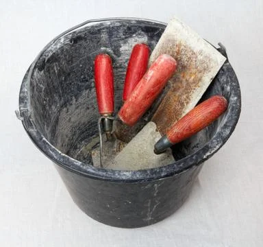 Bucket with masonry tools Stock Photos