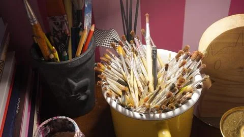 Bucket of paintbrushes Stock Photos